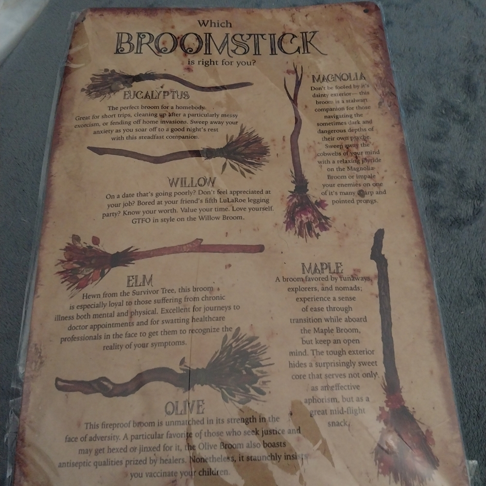 Metal broomstick sign